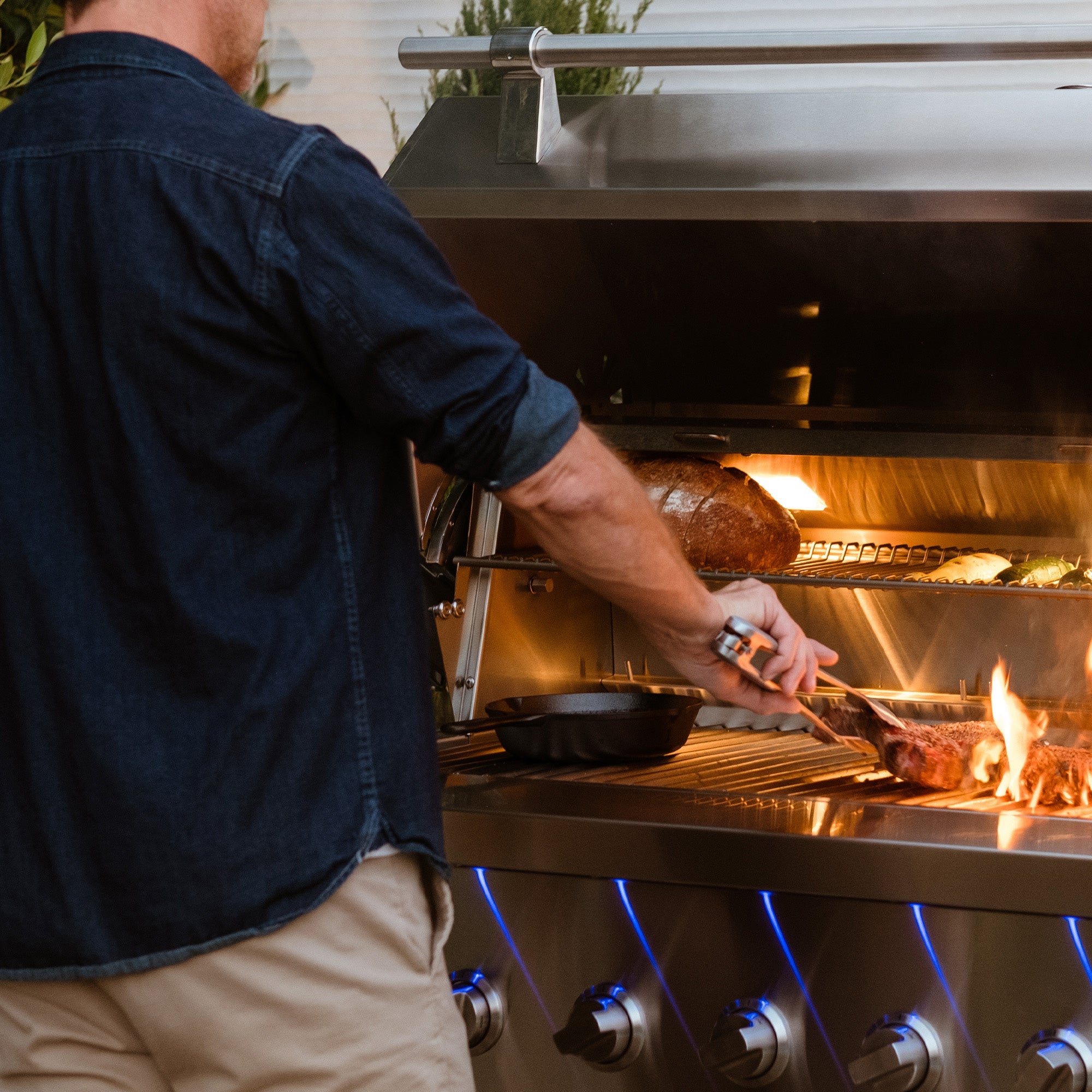 Encore 54" Hybrid Grill cooking meat, lifestyle shot
