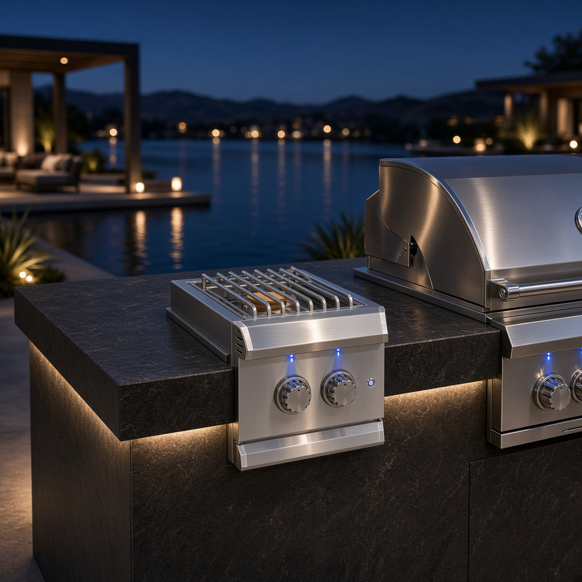 Atlas Power Burner installed in a waterfront outdoor kitchen island at dusk, paired with a matching American Made Grills built-in grill