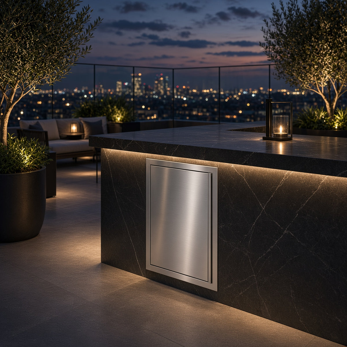 AMG 18-Inch Deluxe Vertical Single Access Door installed in a rooftop outdoor kitchen counter with a city skyline view