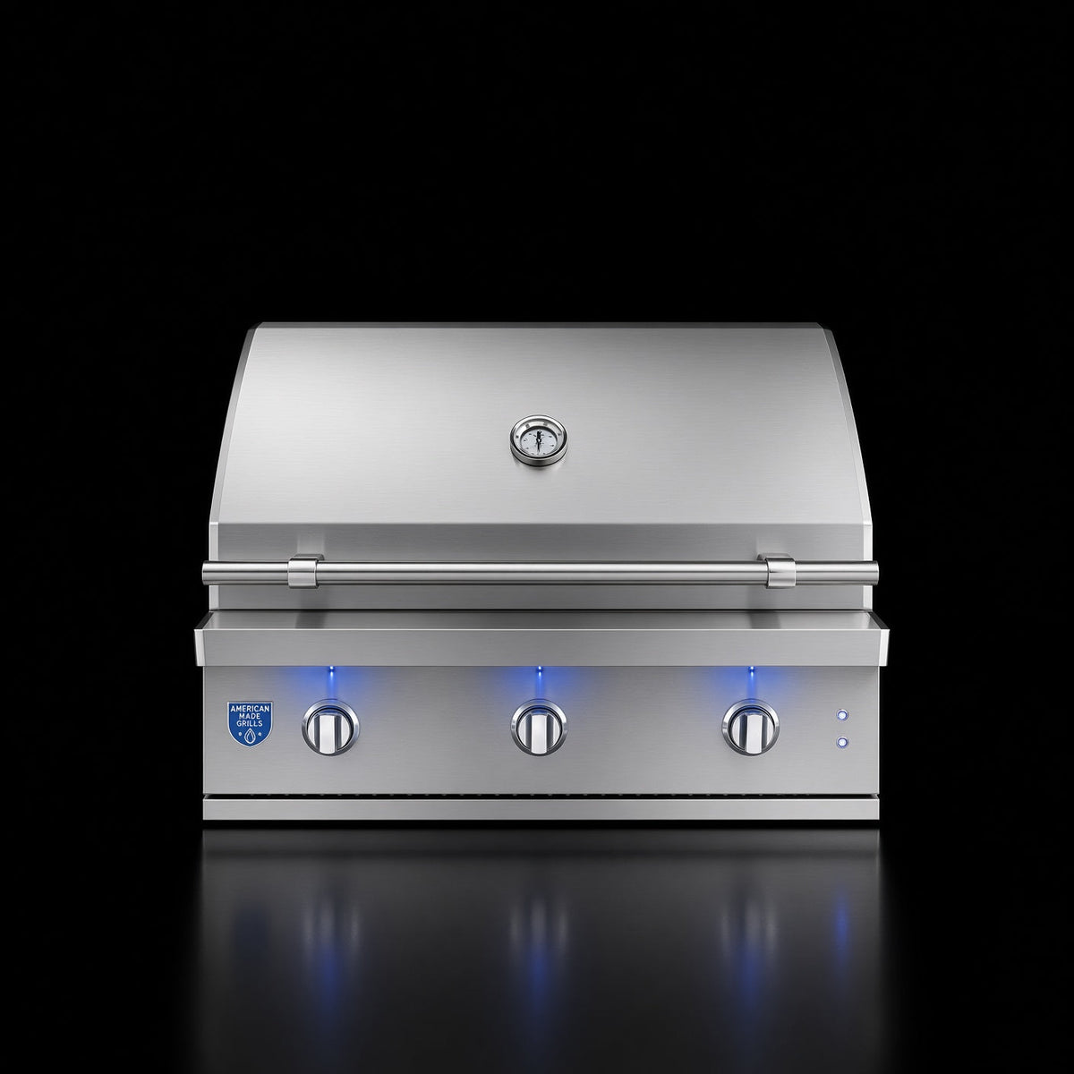 American Made Grills Atlas 36-inch Built-In Grill, closed front view with illuminated control knobs