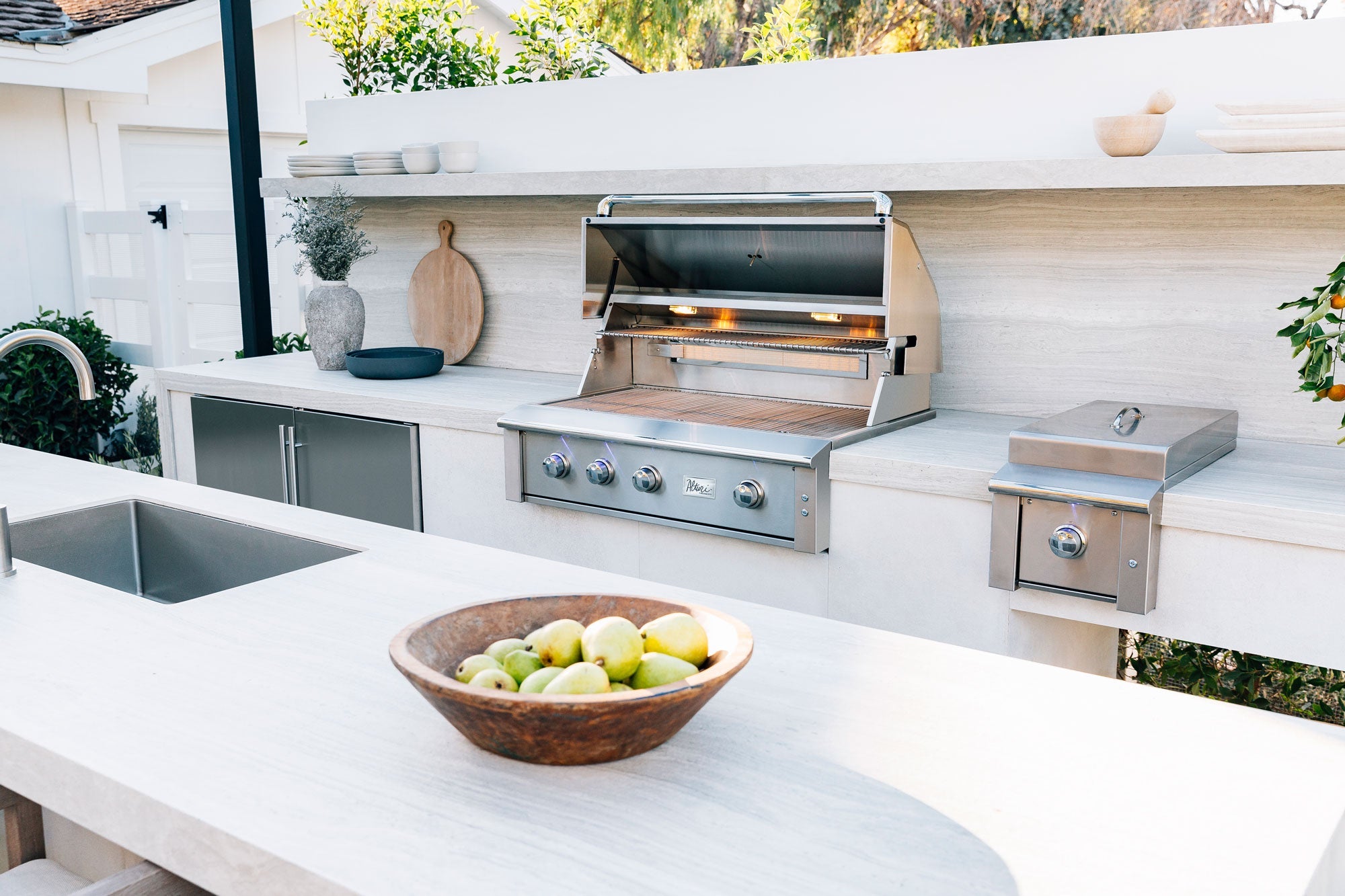 Alturi 36" Built-In Grill, installed in an outdoor kitchen lifestyle setting
