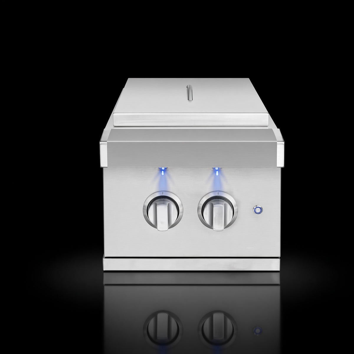 American Made Grills Atlas Double Side Burner, angled view with closed lid and illuminated control knobs