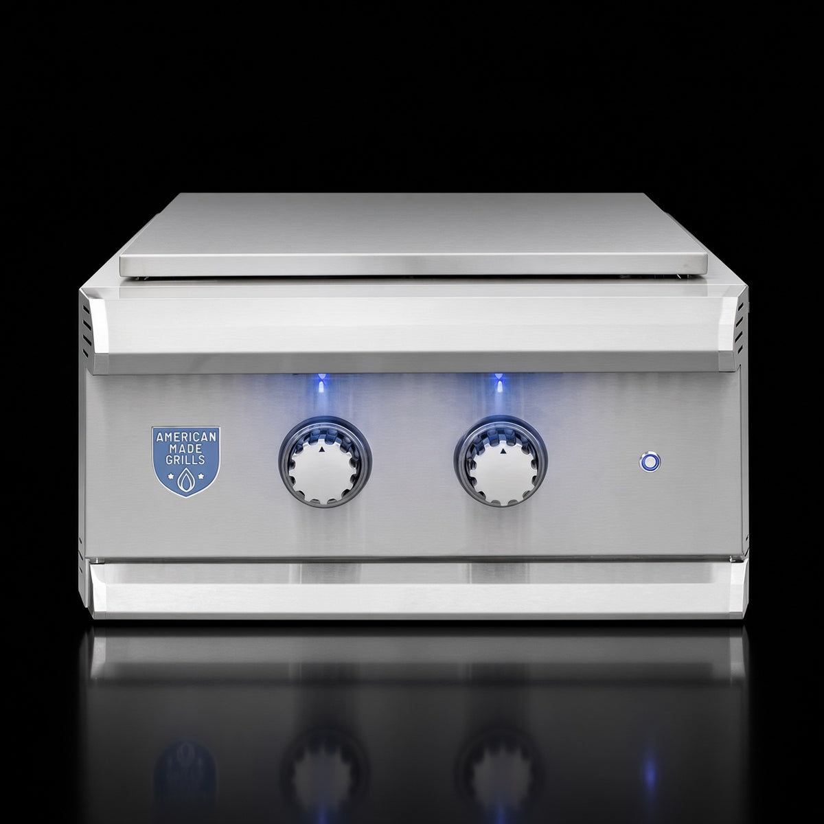 Atlas Power Burner side burner, angled view of closed stainless steel lid with illuminated knobs