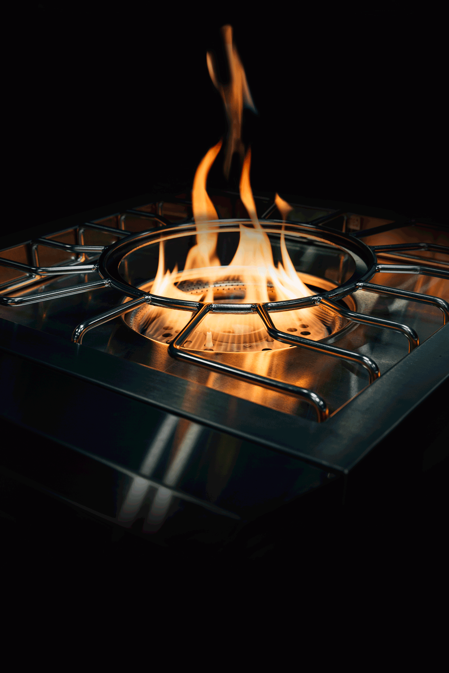 Encore Power Burner, lit burner glowing against a dark background